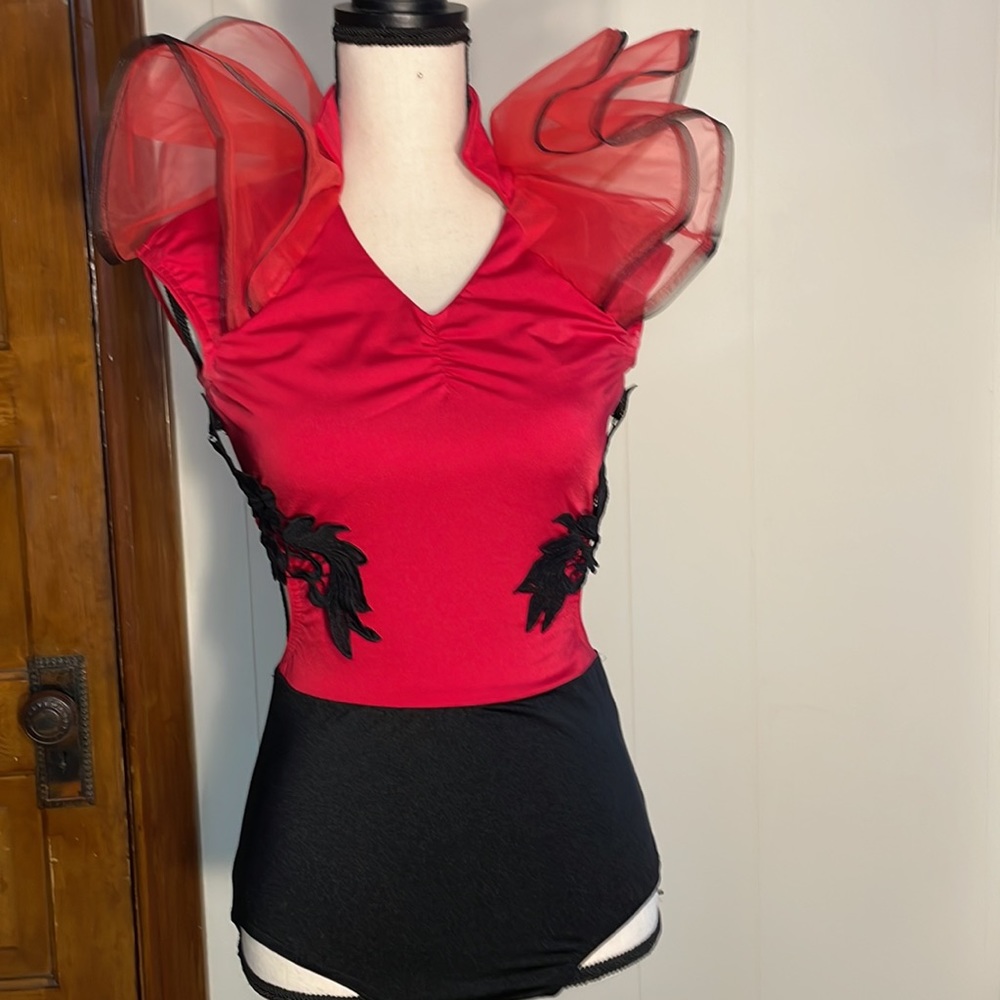 Red and black. One piece jazz dance costume with matching gloves. Size small